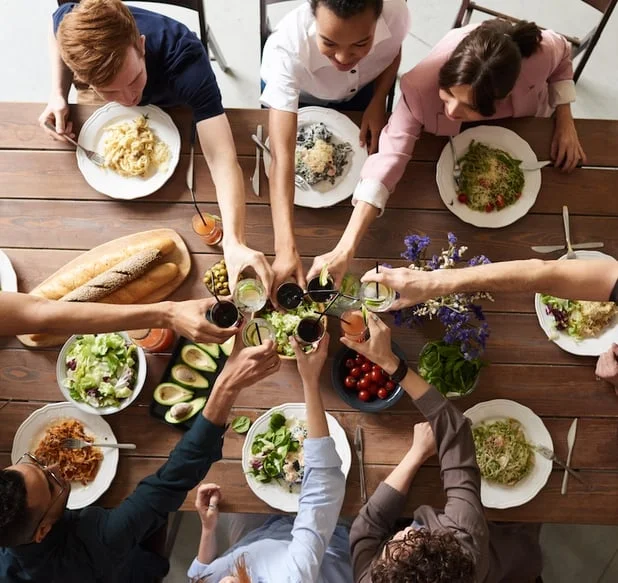 Friends sharing a meal — the kind of night that earns iBerry points.